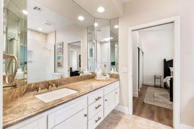 a front view of a house with a garden and a yard