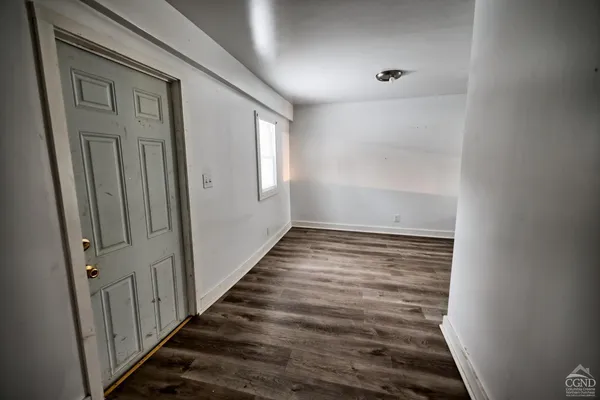 a bedroom with a bed and a table