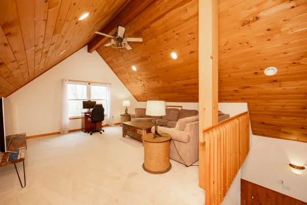 a kitchen with stainless steel appliances granite countertop a stove top oven a sink dishwasher a refrigerator and cabinets with wooden floor