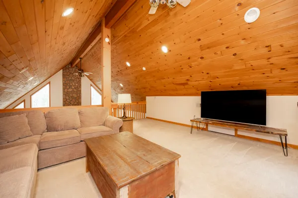 a kitchen with stainless steel appliances granite countertop a refrigerator a stove and a wooden cabinets