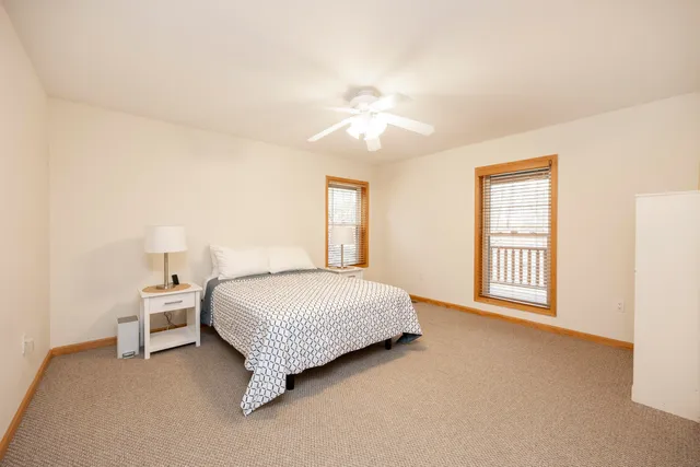 a white bath tub sitting next to a white toilet