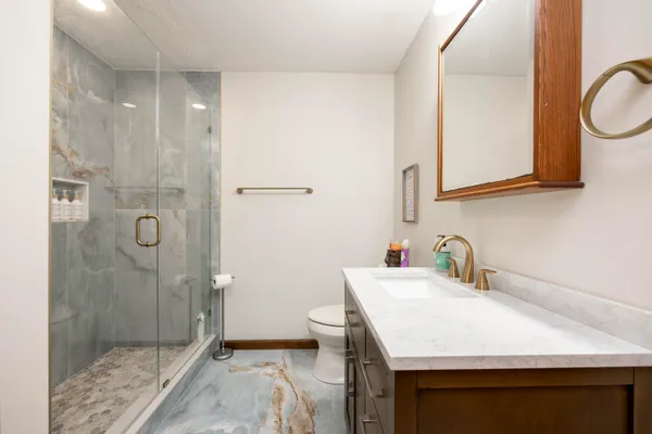 a bedroom with a bed and a television