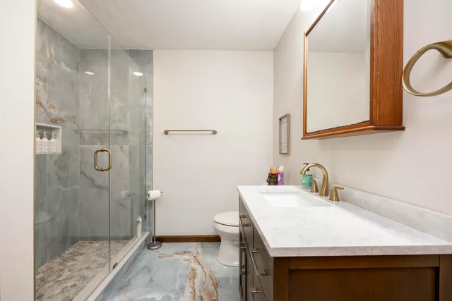 a bedroom with a bed and a television