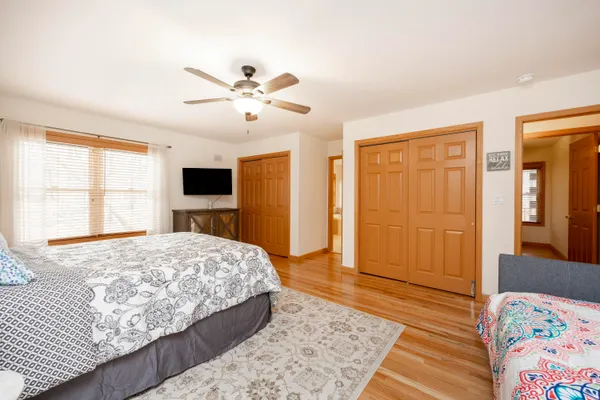 a view of a patio with table and chairs and wooden floor