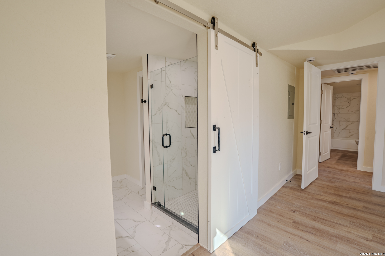 3206 La Rosa Street San Antonio, TX 78211 - Photo 13 of 18 a view of a bathroom with a shower and a sink