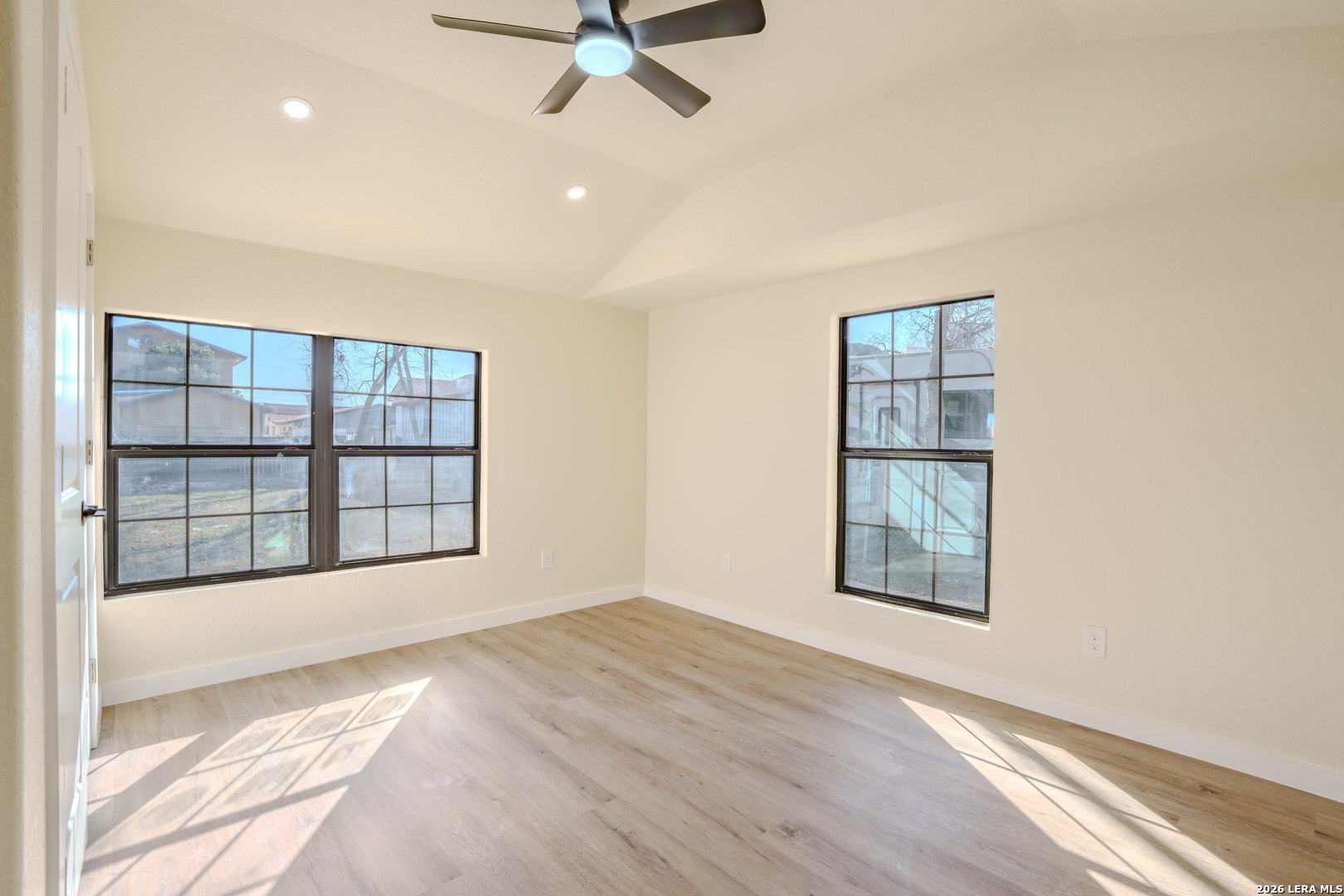 3206 La Rosa Street San Antonio, TX 78211 - Photo 14 of 18 an empty room with wooden floor and windows