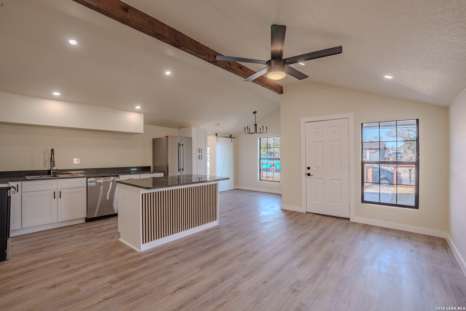 3206 La Rosa Street San Antonio, TX 78211 - Photo 3 of 18 a kitchen with stainless steel appliances granite countertop a sink cabinets and wooden floor
