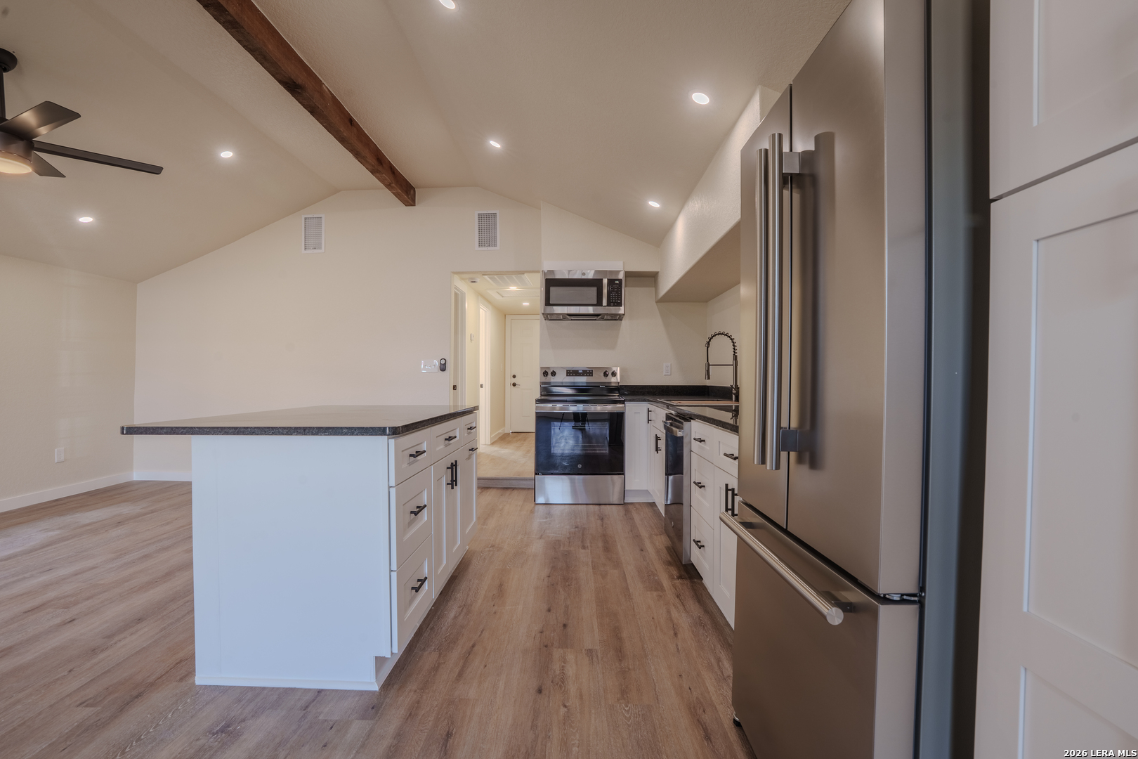 3206 La Rosa Street San Antonio, TX 78211 - Photo 5 of 18 a kitchen with refrigerator cabinets and stainless steel appliances