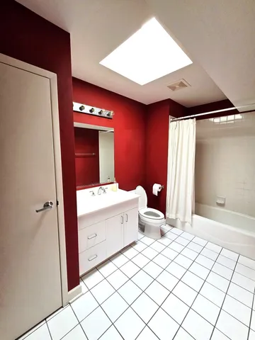 a bathroom with a sink mirror and vanity