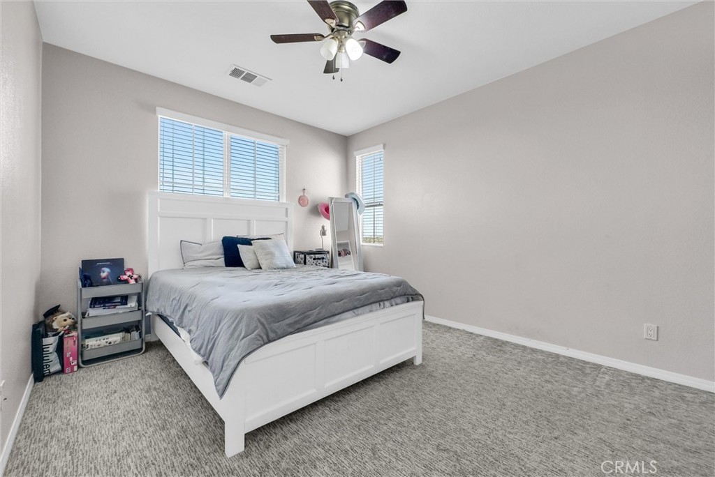 18388 Hidden Ranch Road Riverside, CA 92508 - Photo 38 of 46 a bedroom with a bed and window