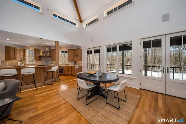 a living room with furniture wooden floor and a fireplace