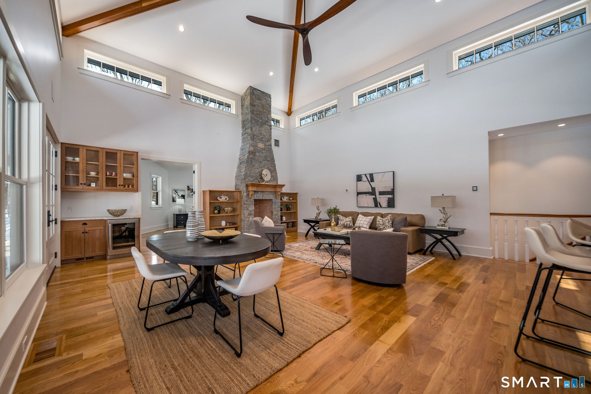 81 Strawberry Hill Road Madison, CT 06443 - Photo 13 of 40 a living room with furniture and a wooden floor