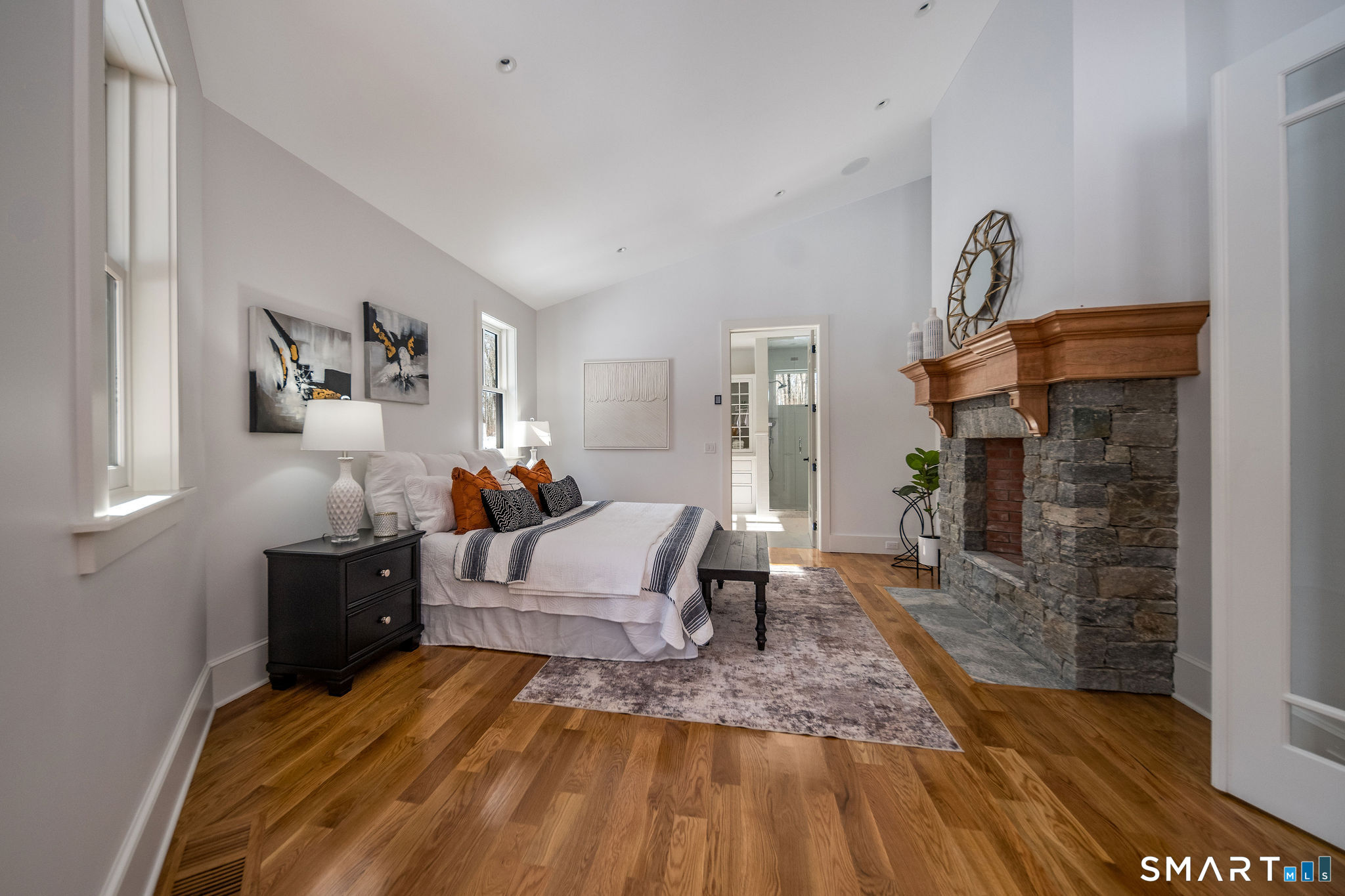 81 Strawberry Hill Road Madison, CT 06443 - Photo 16 of 40 a living room with furniture and a fireplace