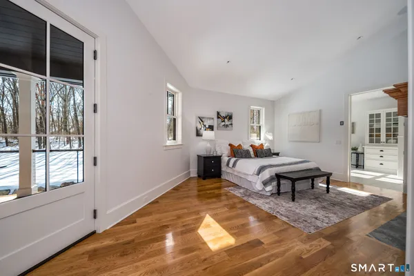 a bathroom with a sink toilet and window