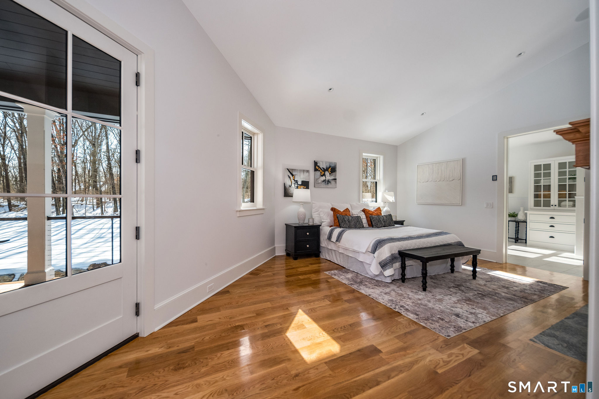 81 Strawberry Hill Road Madison, CT 06443 - Photo 17 of 40 a living room with furniture a rug and a window