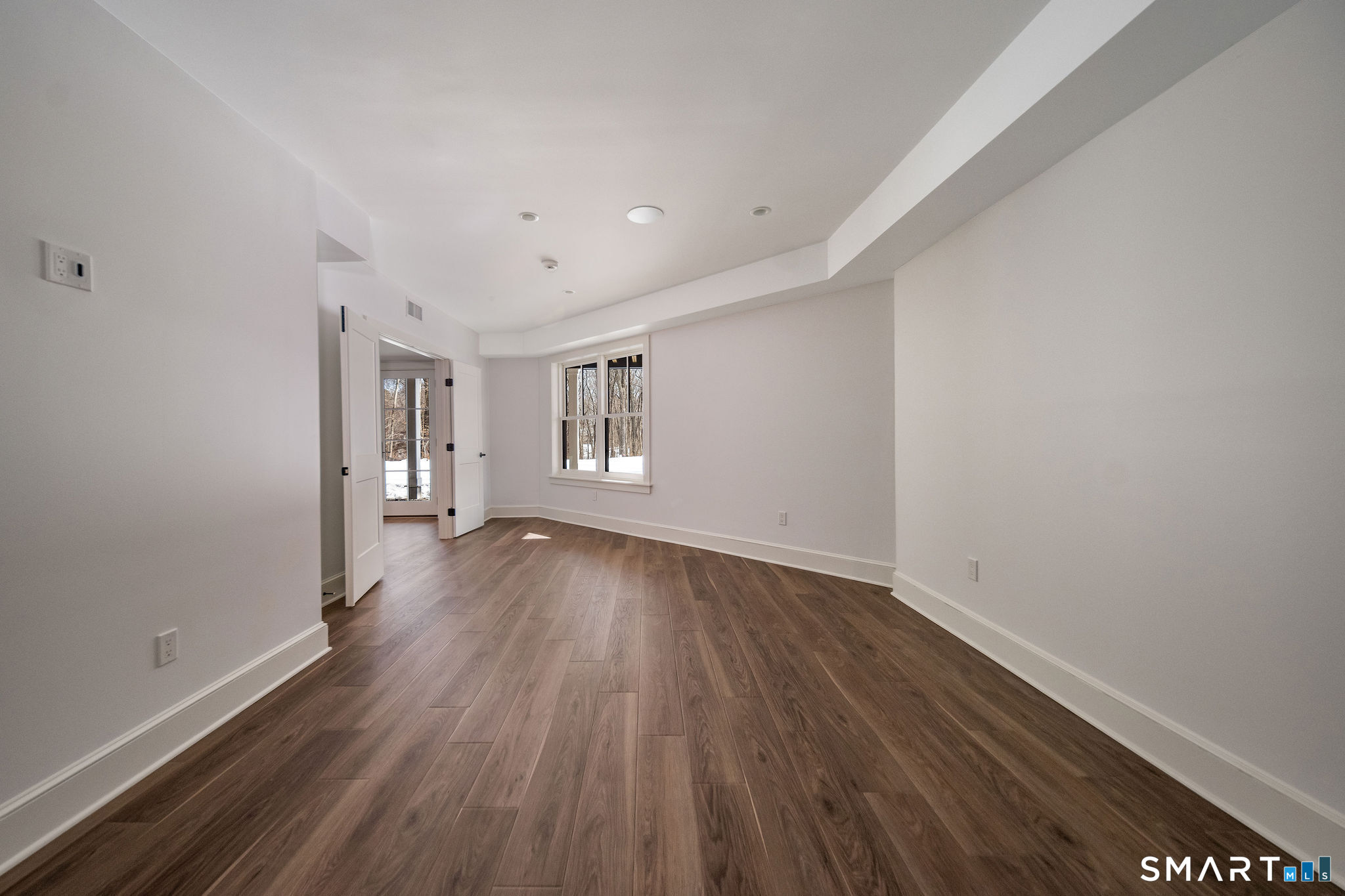 81 Strawberry Hill Road Madison, CT 06443 - Photo 26 of 40 wooden floor in an empty room with a window