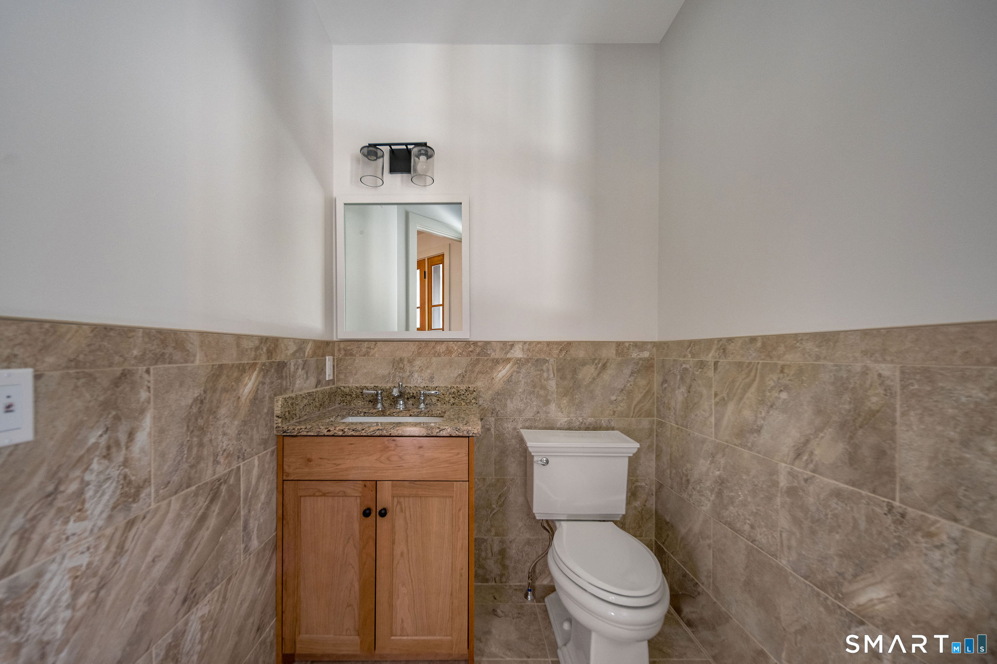 81 Strawberry Hill Road Madison, CT 06443 - Photo 28 of 40 a bathroom with a sink and a toilet