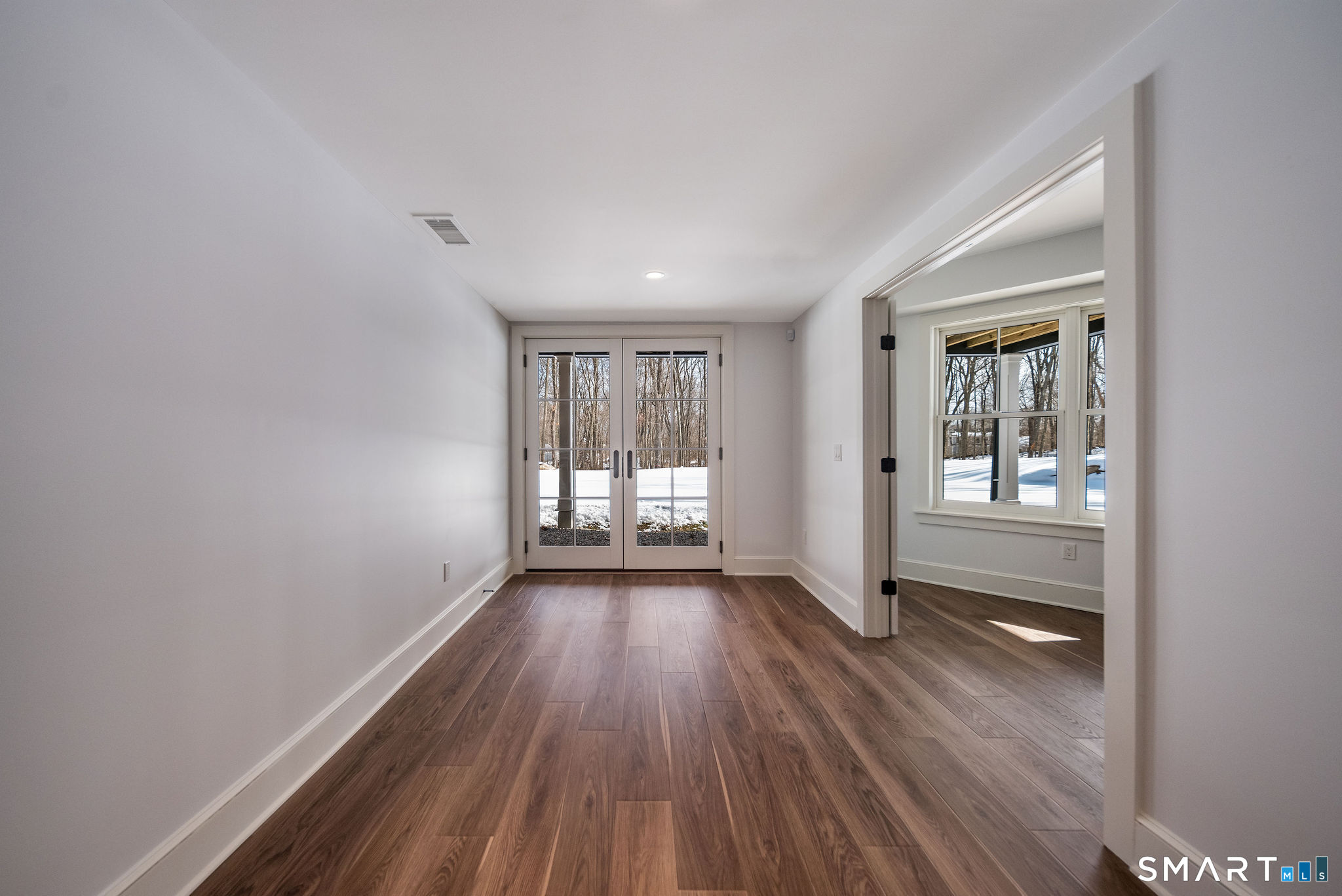 81 Strawberry Hill Road Madison, CT 06443 - Photo 29 of 40 wooden floor in an empty room with a window