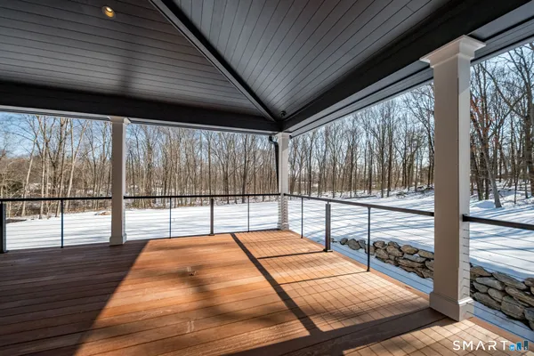 a view of balcony with wooden floor