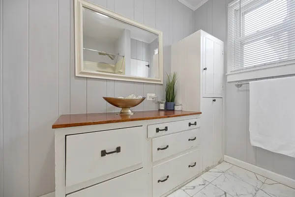 a view of room with cabinets and wooden floor