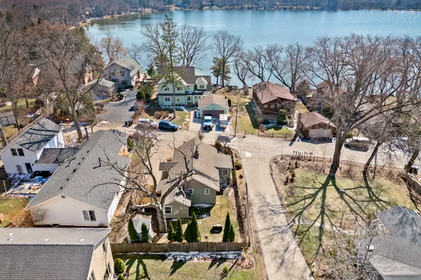 a view of swimming pool with a yard and lake view