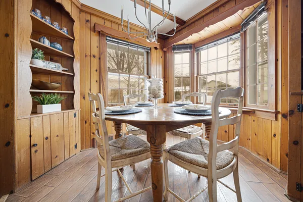 a view of a dining room with furniture window and outside view