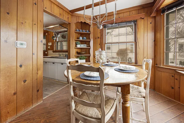 a view of a dining room with furniture and window