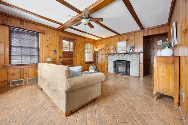 a living room with furniture and a fireplace