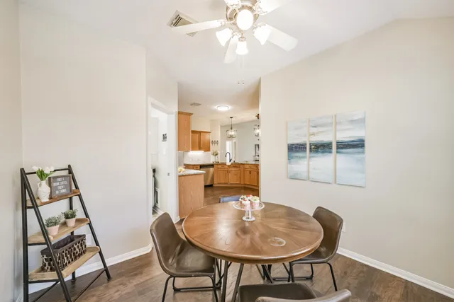 a dining room with furniture and chandelier