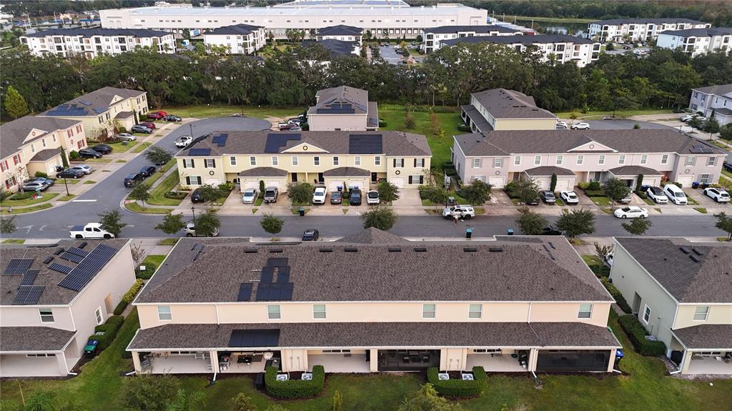 12418 Bowes Branch Road Orlando, FL 32824 - Photo 14 of 21 an aerial view of multiple houses with a big yard