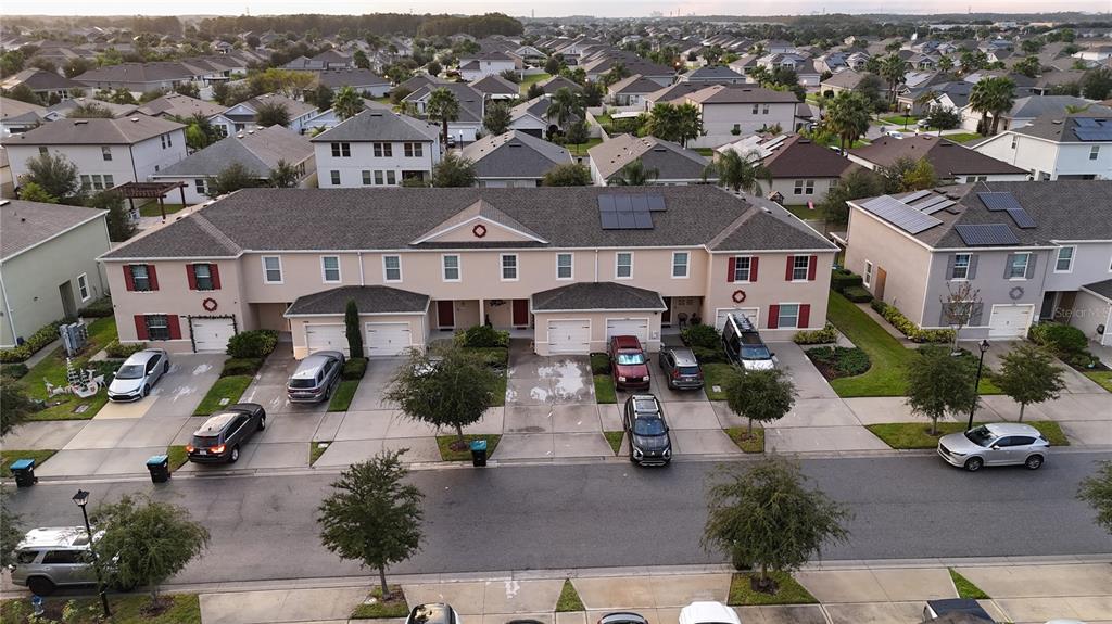 12418 Bowes Branch Road Orlando, FL 32824 - Photo 17 of 21 an aerial view of multiple houses with yard