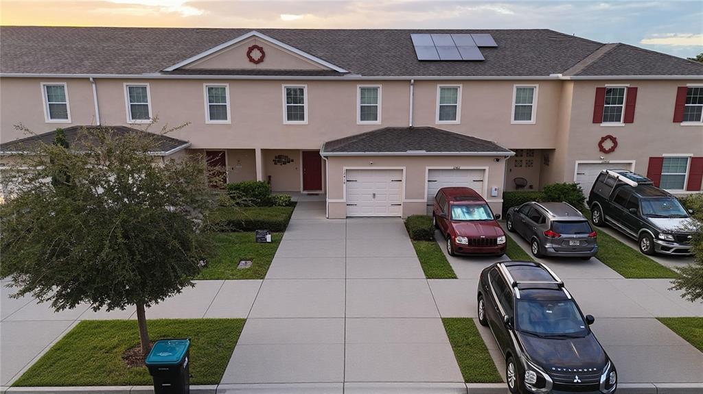 12418 Bowes Branch Road Orlando, FL 32824 - Photo 3 of 21 a front view of a house with garden
