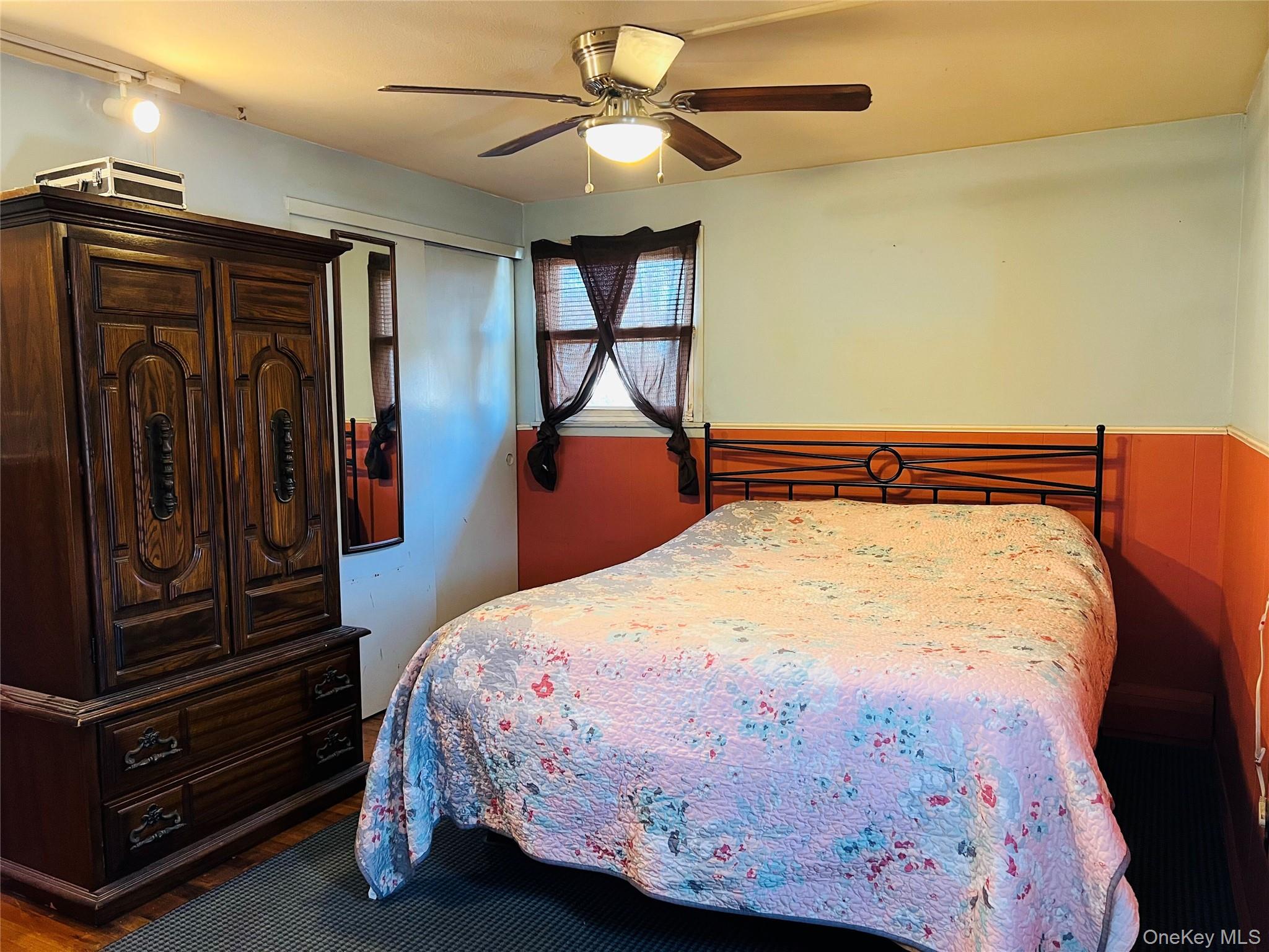 38 Riviera Drive Selden, NY 11784 - Photo 5 of 12 Bedroom with ceiling fan, wood finished floors, and a closet