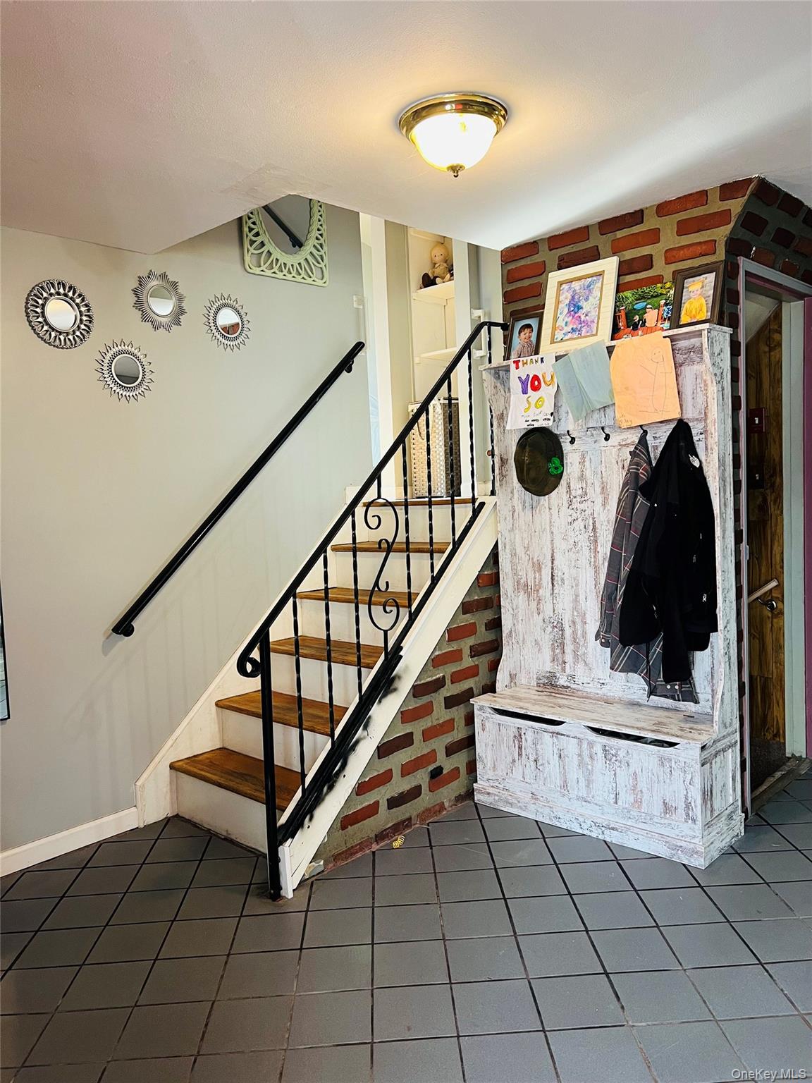 38 Riviera Drive Selden, NY 11784 - Photo 8 of 12 Foyer w/Staircase and tile flooring