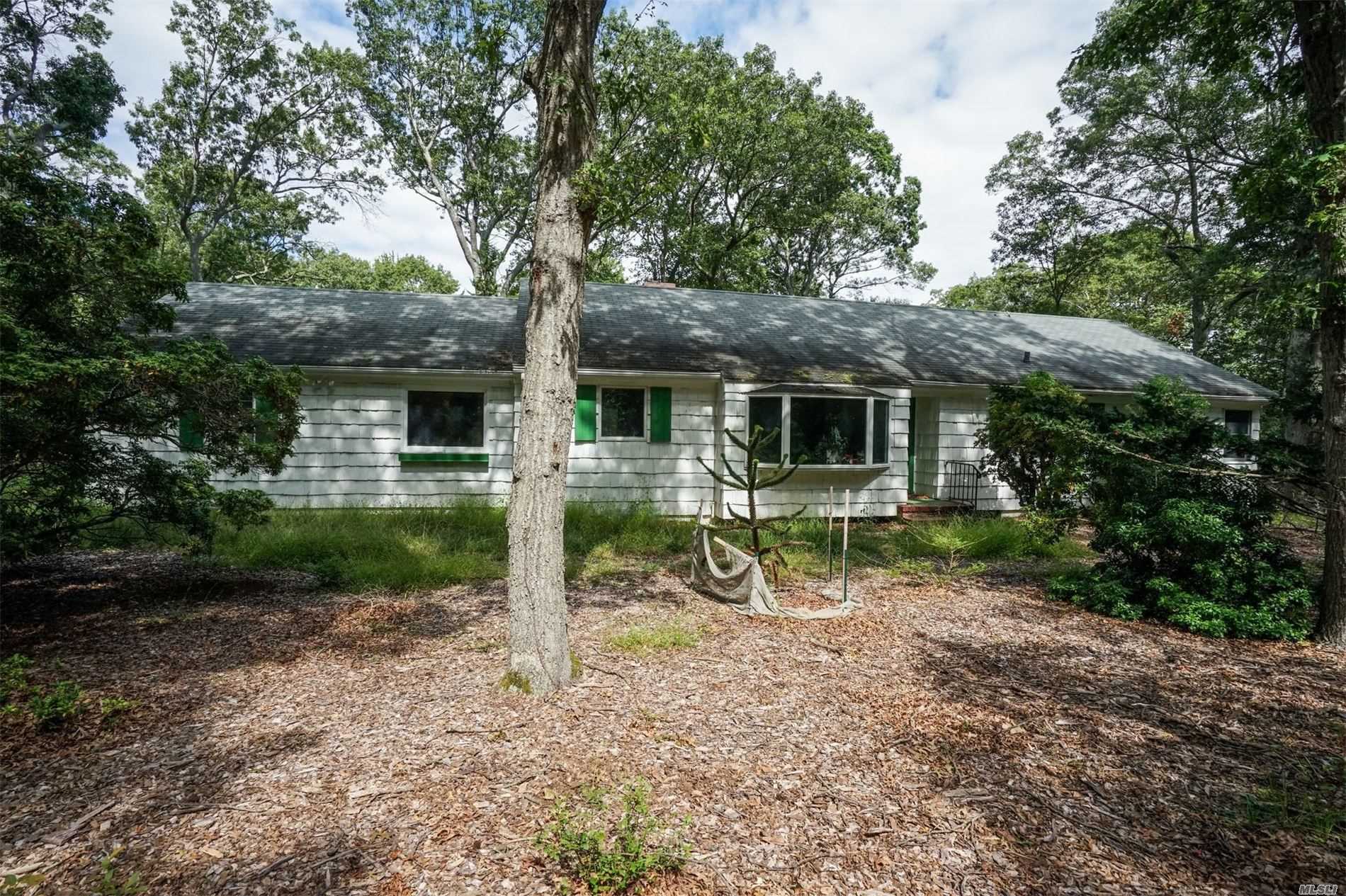 3 Blueberry Ridge Road Old Field, NY 11733 - Photo 1 of 1 a backyard of a house with seating space