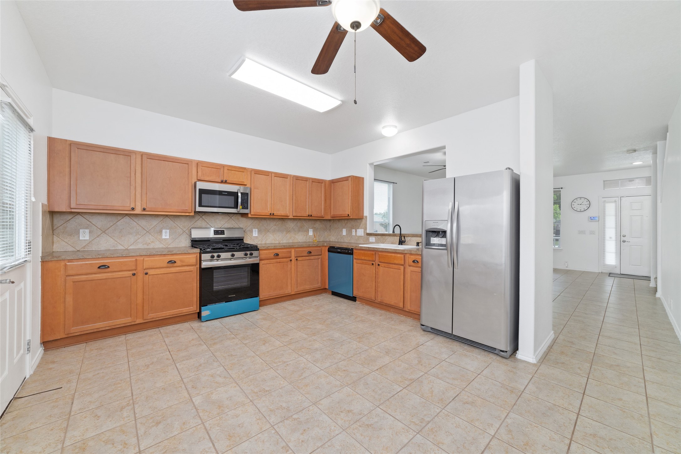 23602 Youpon Lake Lane Spring, TX 77373 - Photo 7 of 21 Open kitchen with ample cabinet space and seamless flow to the living area.