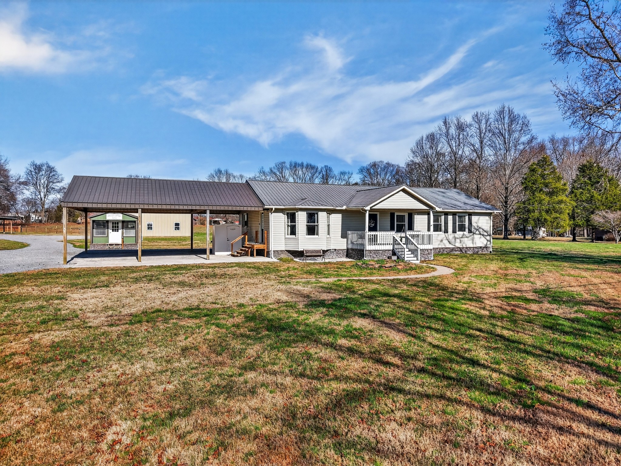 16 Clayton Acres Road Fayetteville, TN 37334 - Photo 2 of 33 a front view of a house with a yard