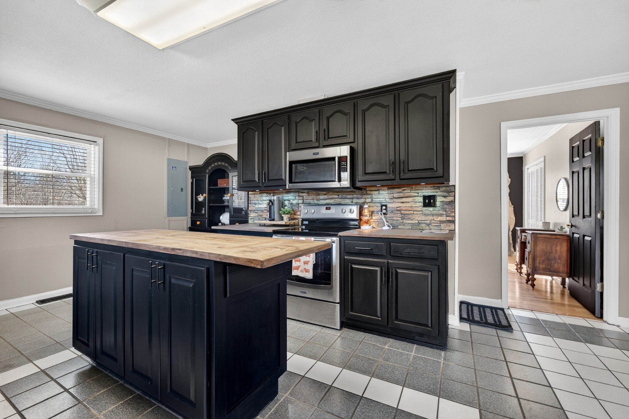 16 Clayton Acres Road Fayetteville, TN 37334 - Photo 7 of 33 a kitchen with stainless steel appliances granite countertop wooden cabinets a sink and a stove