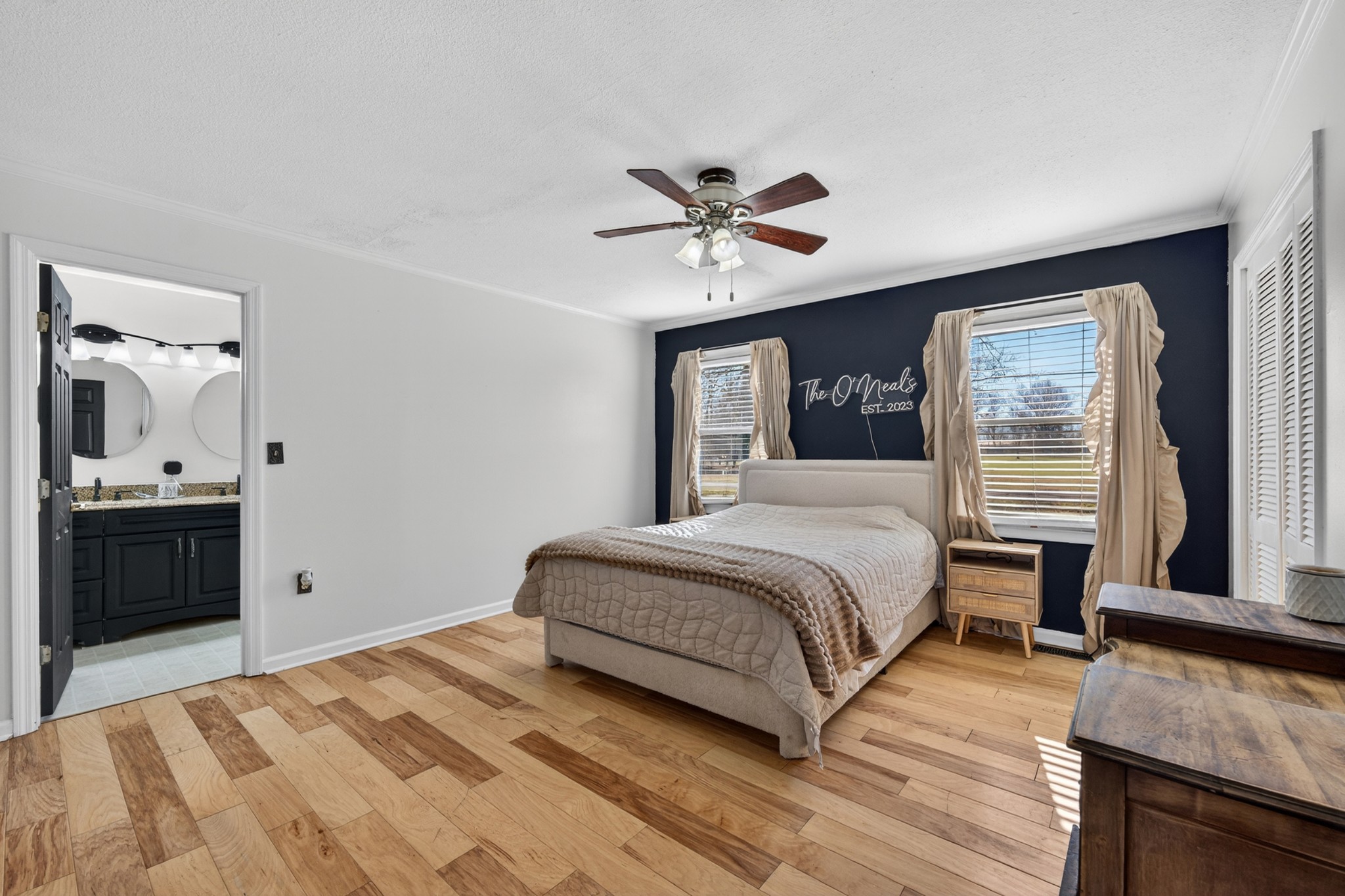 16 Clayton Acres Road Fayetteville, TN 37334 - Photo 10 of 33 a bedroom with a large bed and a chandelier