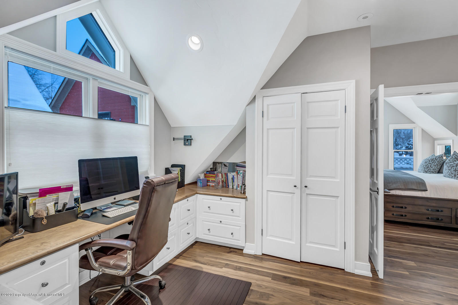 633 West Main Street Aspen, CO 81611 - Photo 13 of 46 a view of a workspace with furniture and a flat screen tv