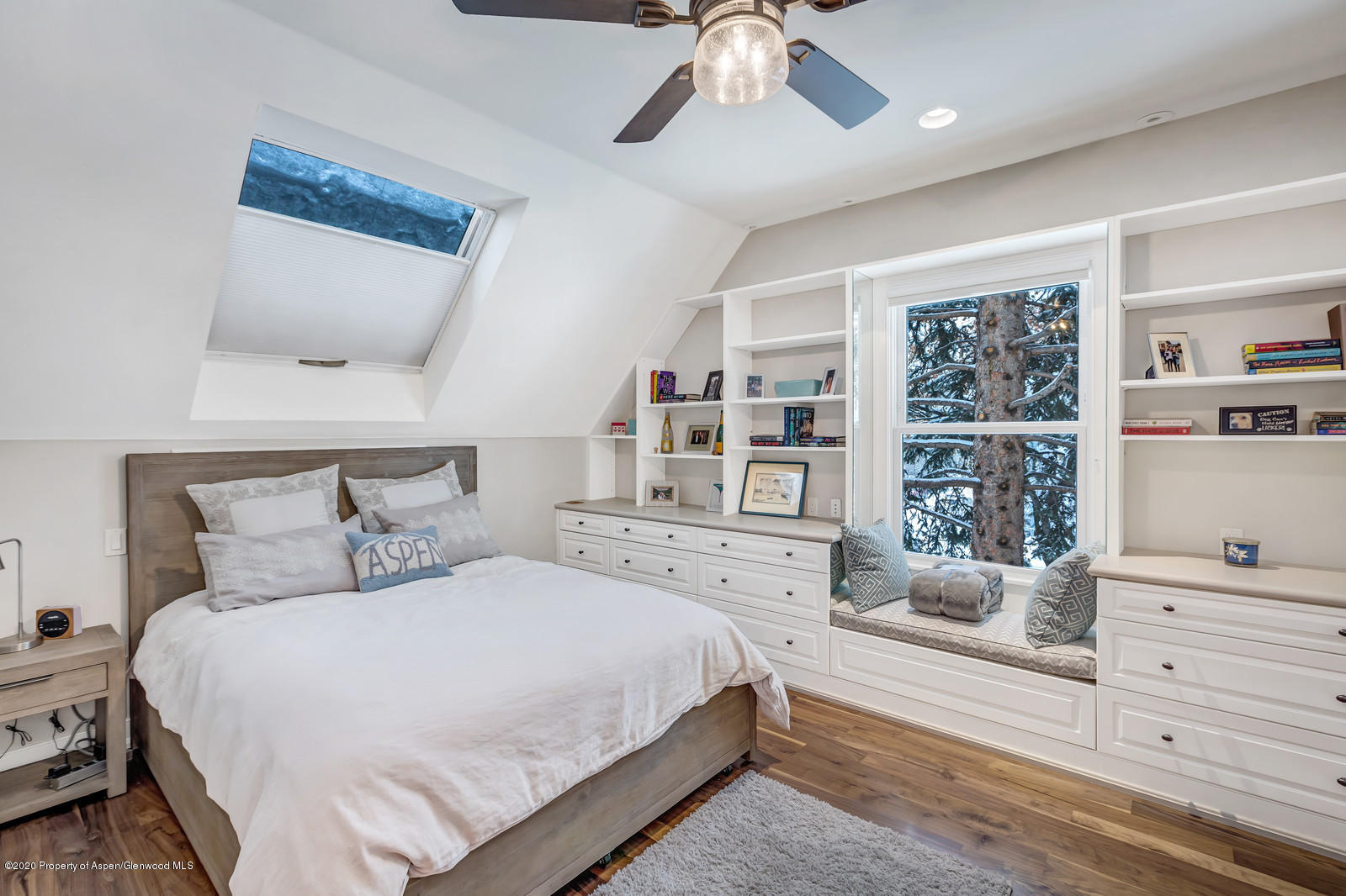 633 West Main Street Aspen, CO 81611 - Photo 14 of 46 a bedroom with a large bed and a window