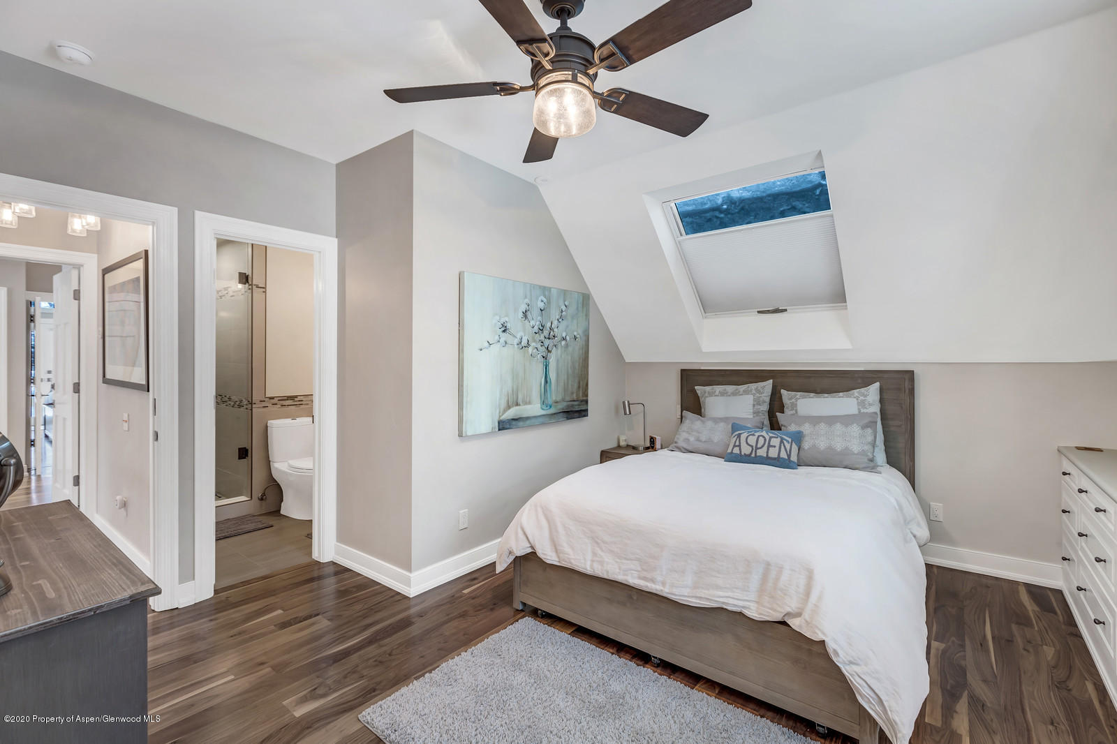 633 West Main Street Aspen, CO 81611 - Photo 15 of 46 a bedroom with a bed and a walk in closet