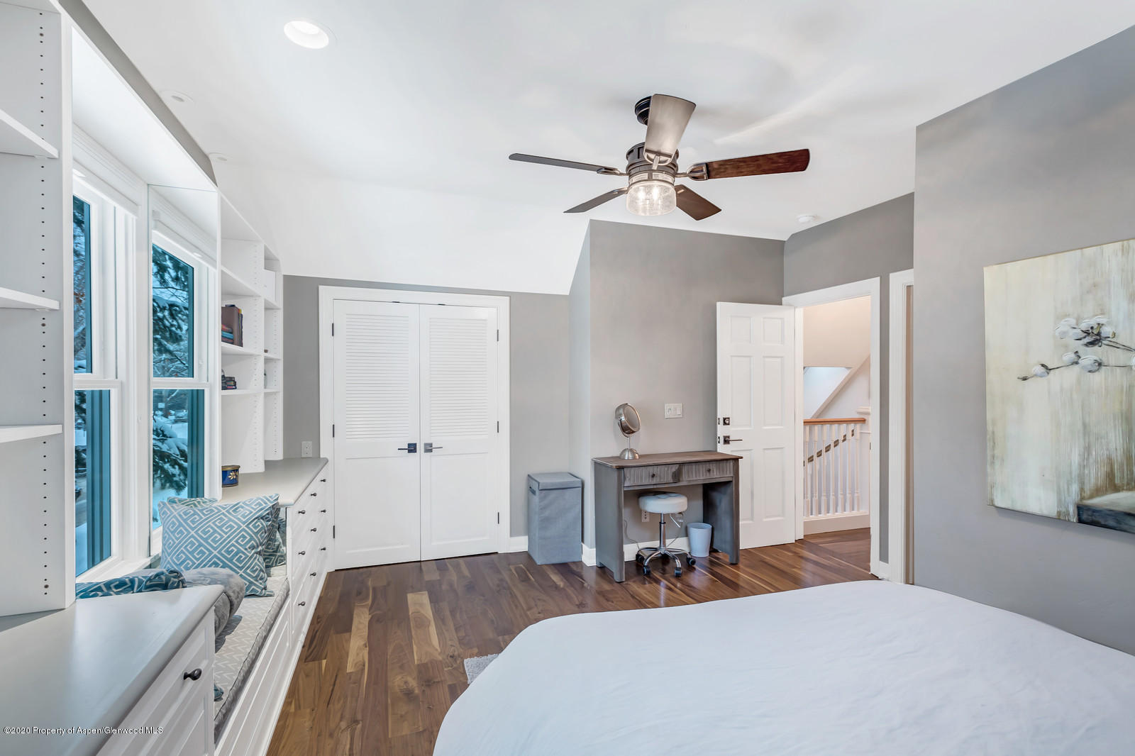 633 West Main Street Aspen, CO 81611 - Photo 17 of 46 a bedroom with a bed and a chandelier
