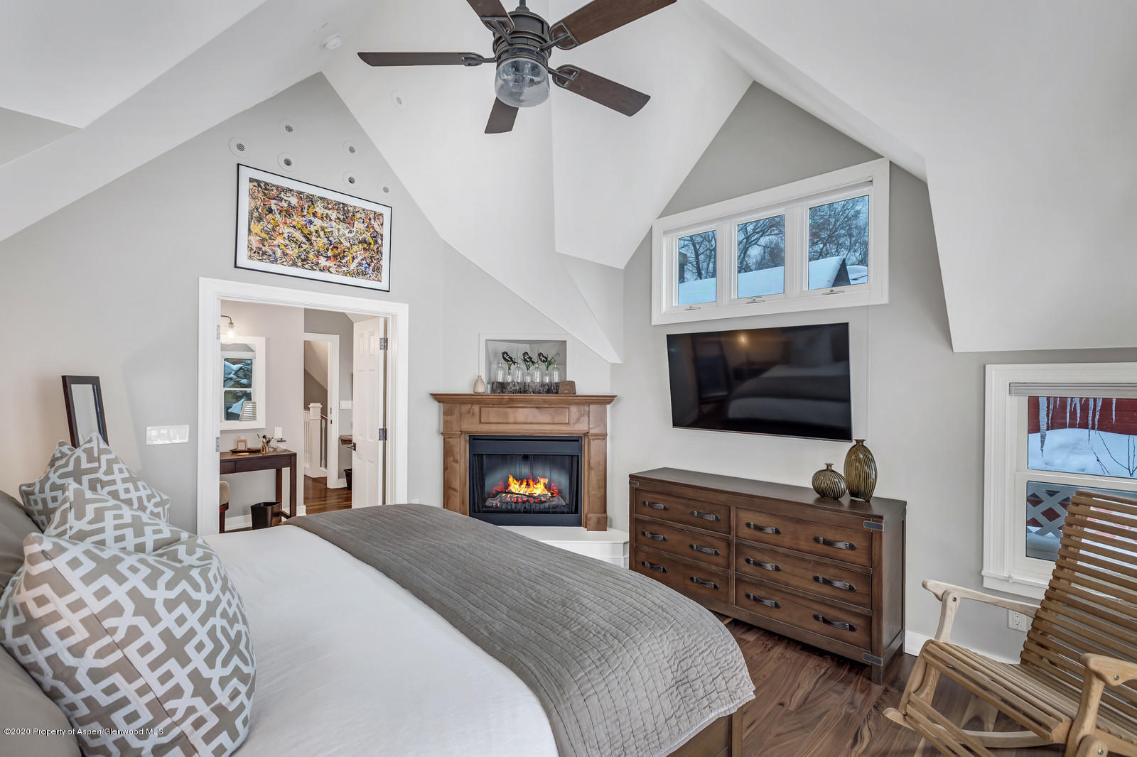 633 West Main Street Aspen, CO 81611 - Photo 2 of 46 a bedroom with a bed and a flat screen tv