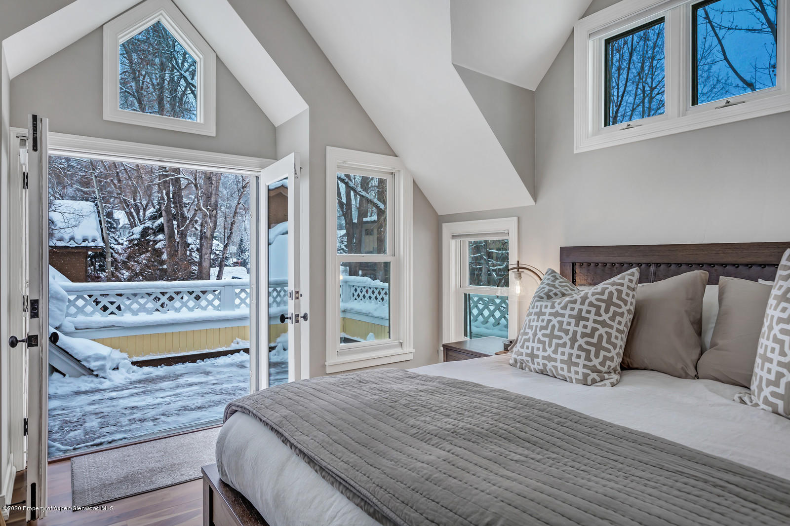 633 West Main Street Aspen, CO 81611 - Photo 3 of 46 a bedroom with a bed and wooden floor