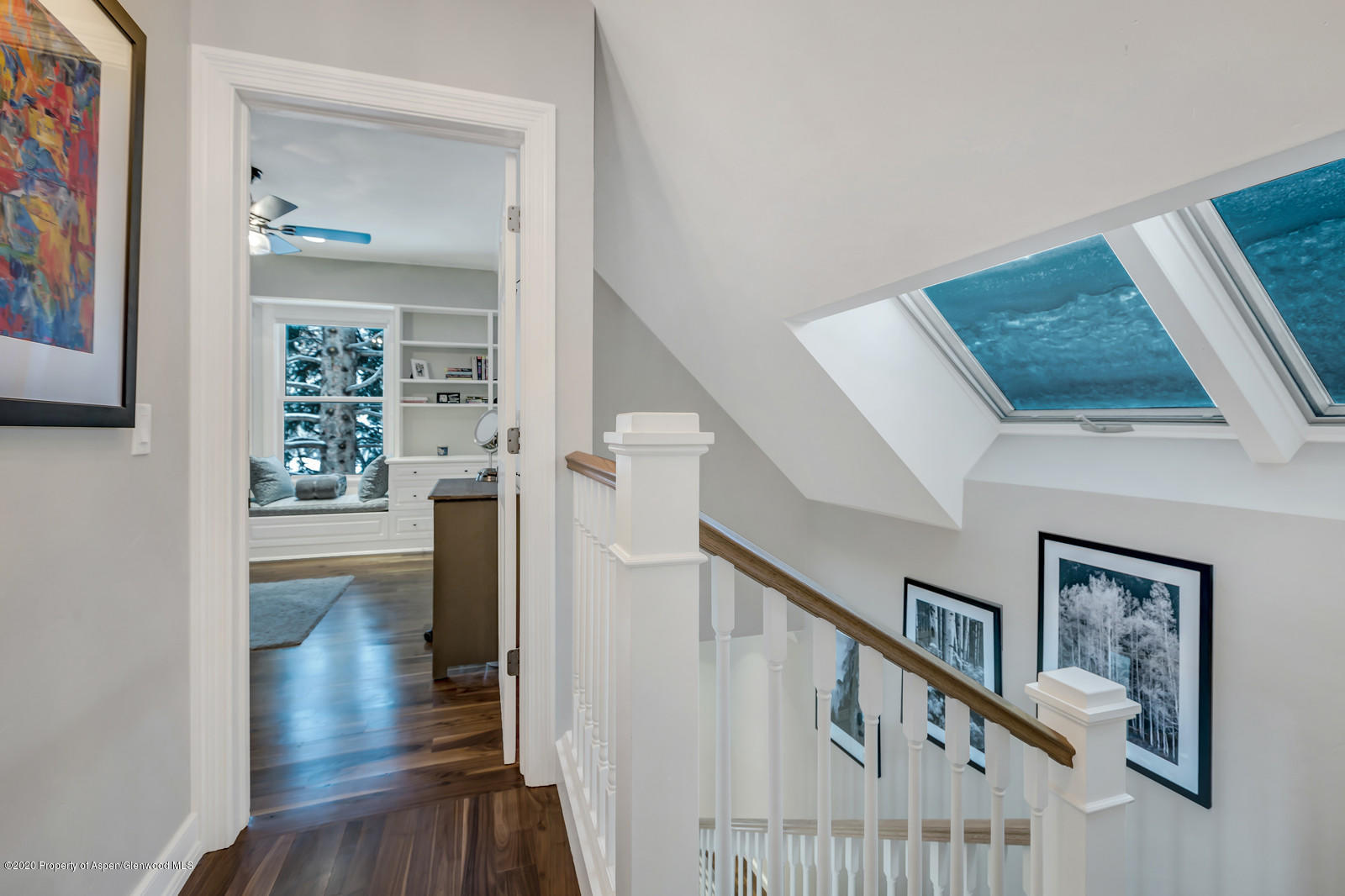 633 West Main Street Aspen, CO 81611 - Photo 32 of 46 a view of a hallway with wooden floor and staircase