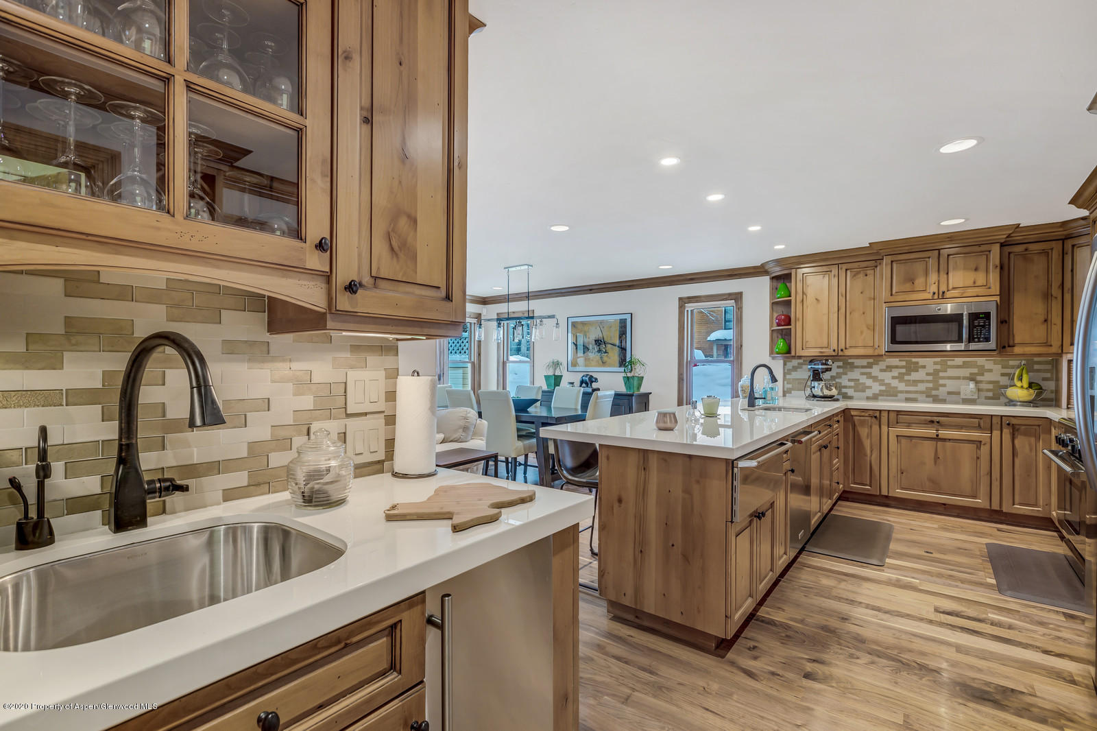 633 West Main Street Aspen, CO 81611 - Photo 40 of 46 a kitchen with a sink and cabinets