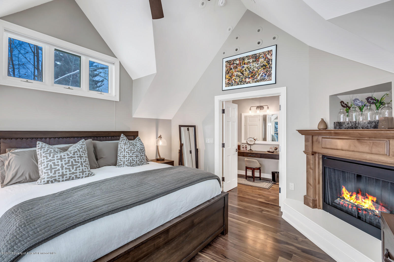 633 West Main Street Aspen, CO 81611 - Photo 6 of 46 a bed room with a bed and a fireplace