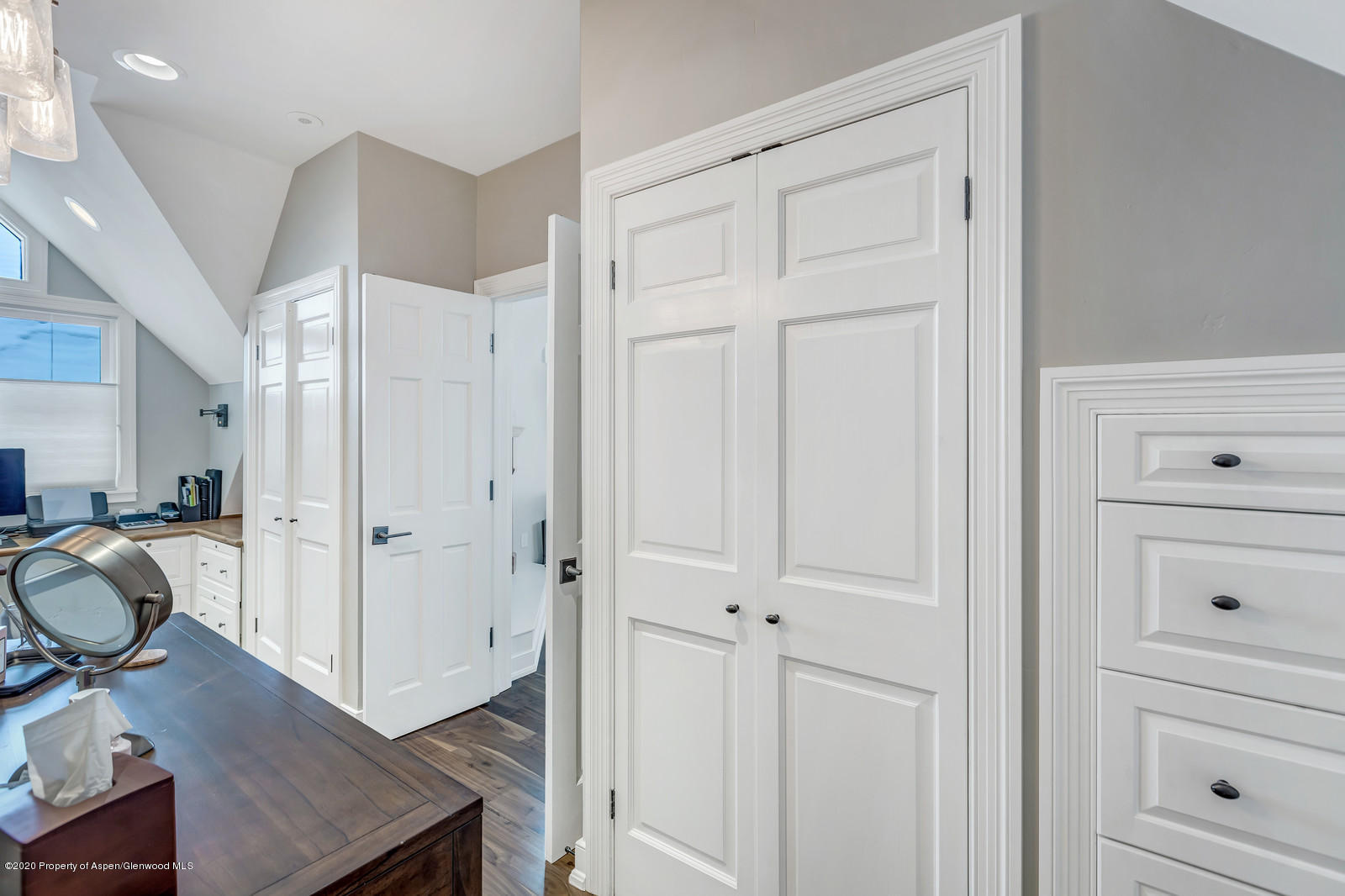 633 West Main Street Aspen, CO 81611 - Photo 8 of 46 a view of a hallway with closet and wooden floor