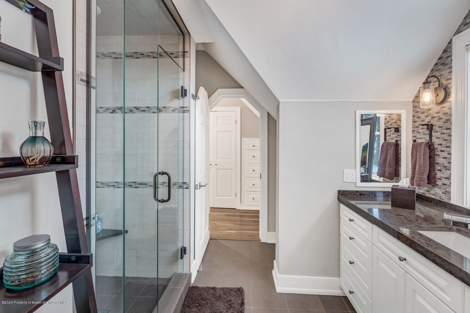633 West Main Street Aspen, CO 81611 - Photo 10 of 46 a bathroom with a granite countertop sink mirror and shower
